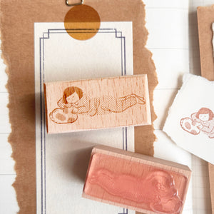Miss Ng Yuk petting a cute cat stamp, detailed illustration featuring a woman gently interacting with a feline.