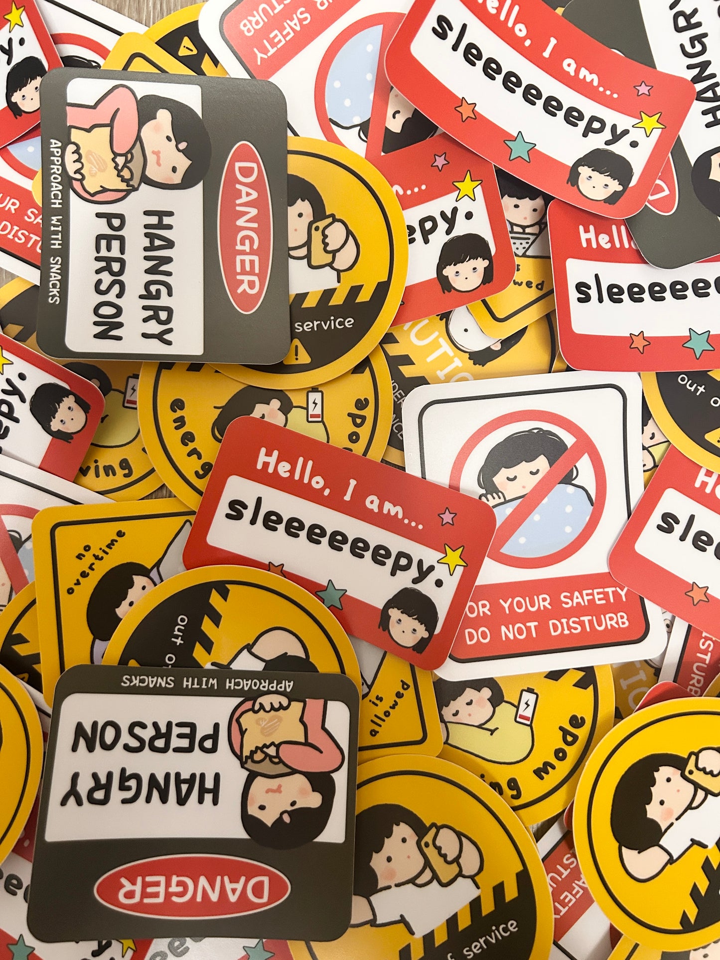 Collection of colorful stickers with cartoon characters and humorous text on a multicolored background.