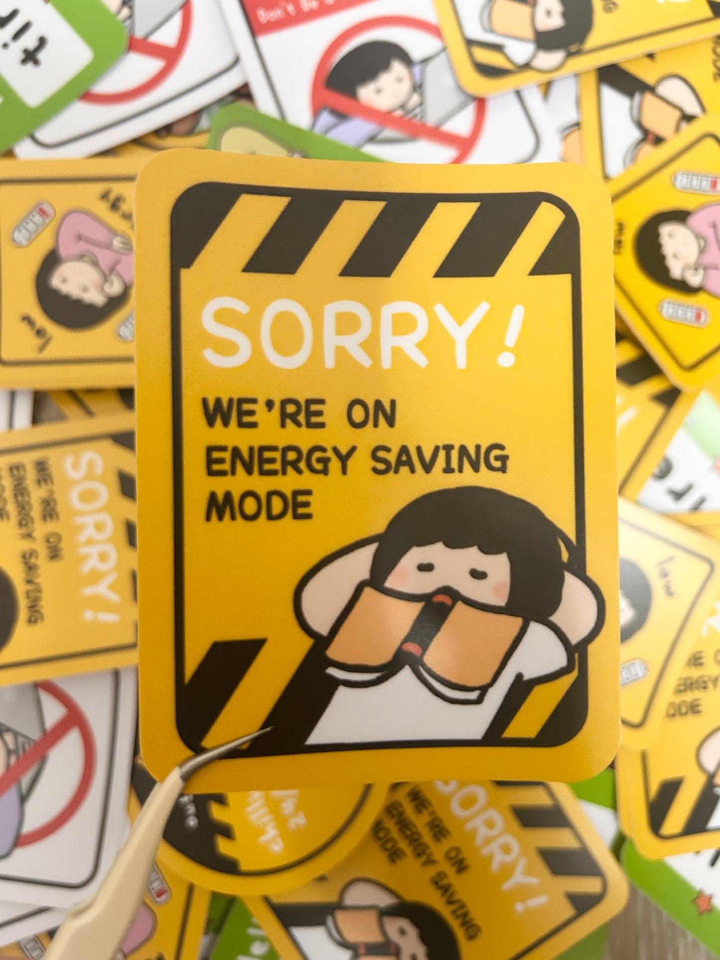 Humorous vinyl sticker warning road signed-themed with text 'Sorry! We're on Energy Saving Mode'.