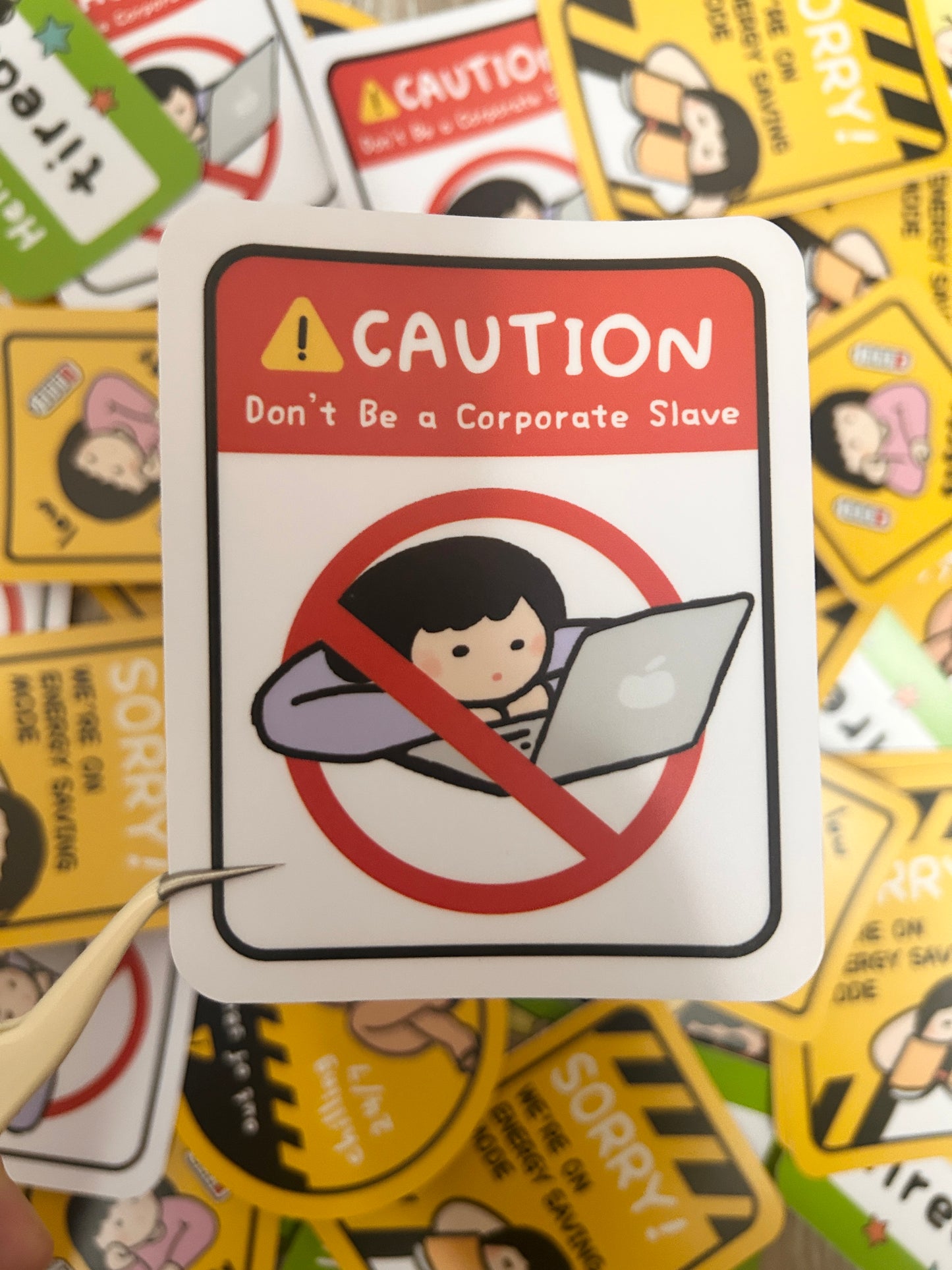 Humorous vinyl sticker warning road signed-themed with text 'Caution! Don't be a corporate slave'.