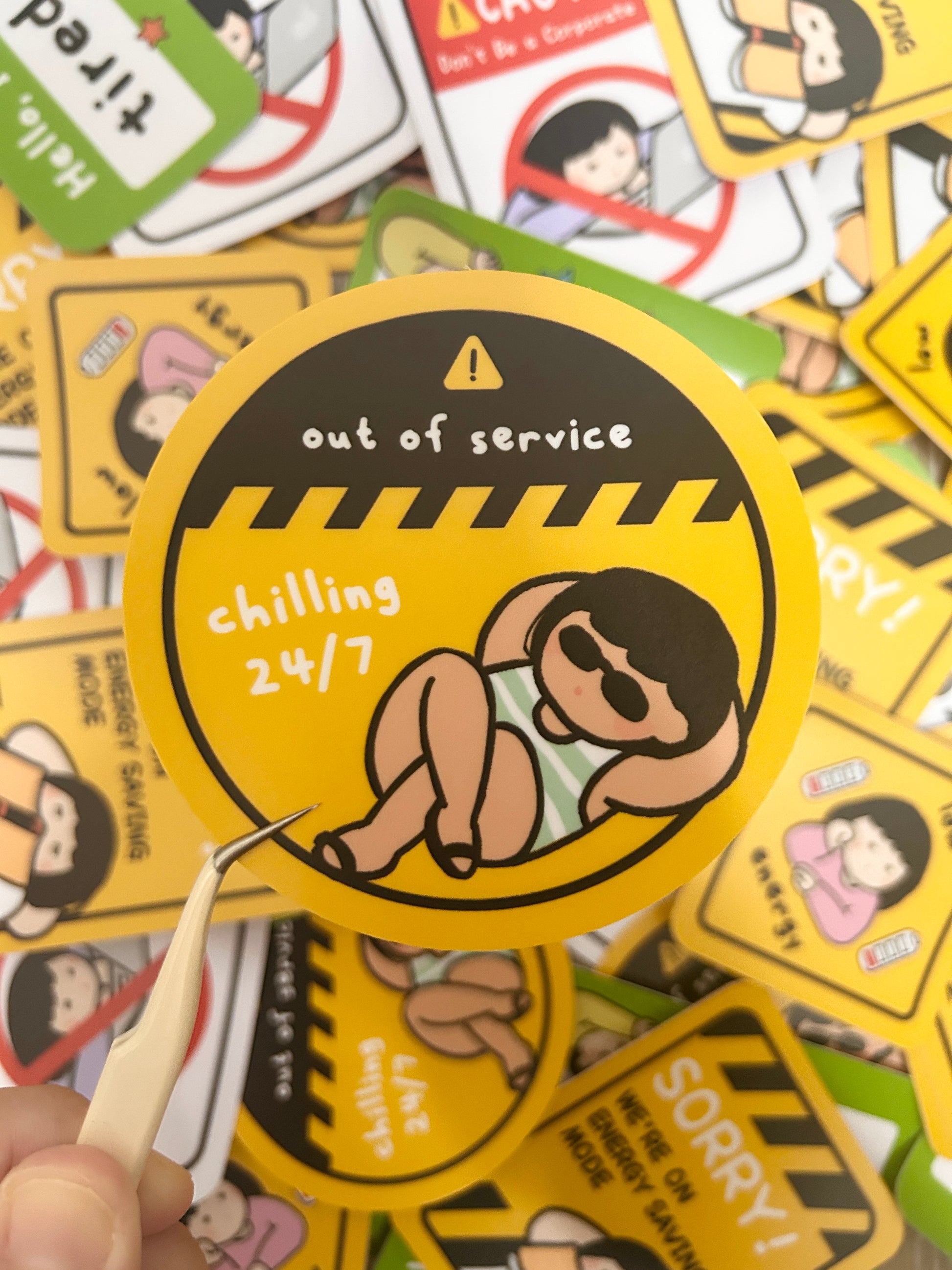 Humorous vinyl sticker warning road signed-themed with text 'Out of service: Chilling 24/7'.