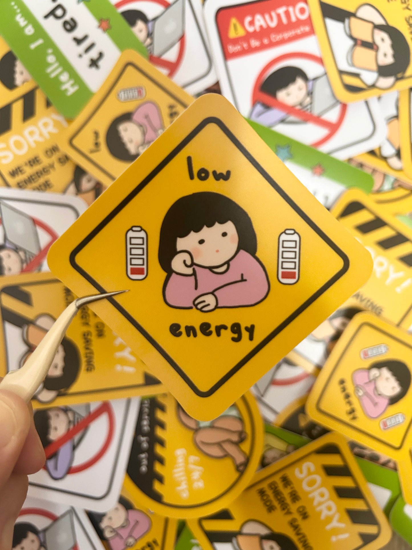 Humorous vinyl sticker warning road signed-themed with text 'low energy'.