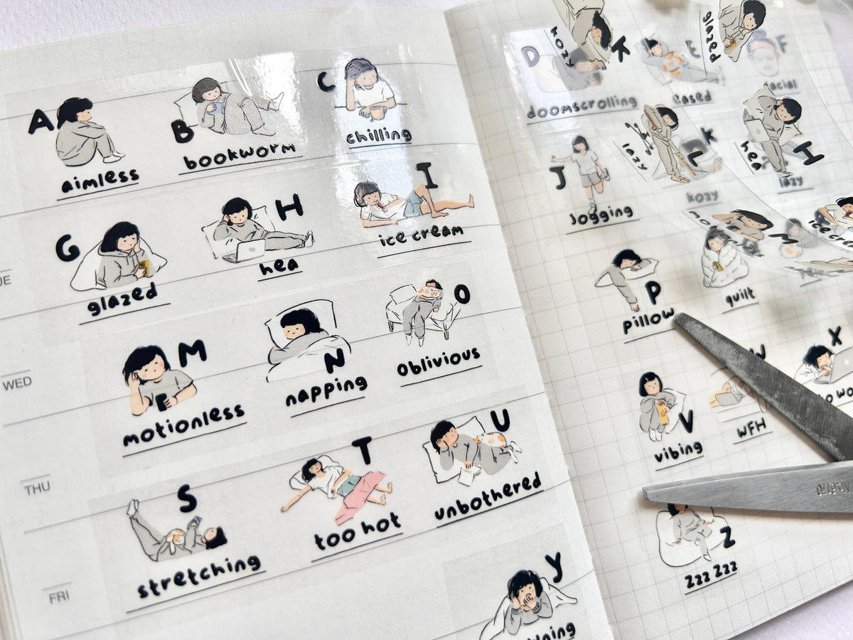 Miss Ng Yuk 26 Stages PET Sticker Tape showing colorful tape rolls arranged in a row for crafting or labeling.