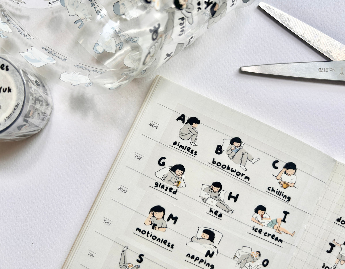 Miss Ng Yuk 26 Stages PET sticker tape roll with colorful adhesive labels for organization and crafting.